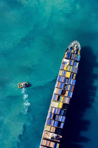 Aerial view of container ship at sea