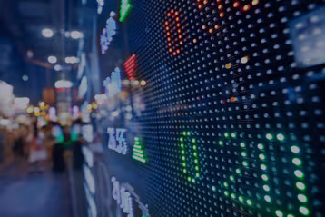Digital market board with illuminated currency values.